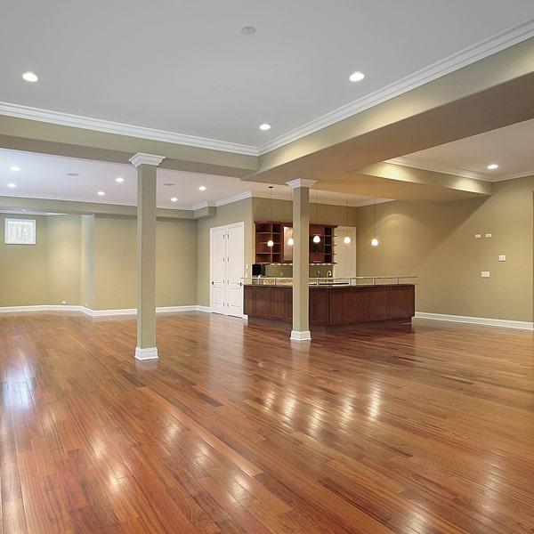 hardwood floors can be installed in a basement or a room with a concrete subfloor with proper preparation